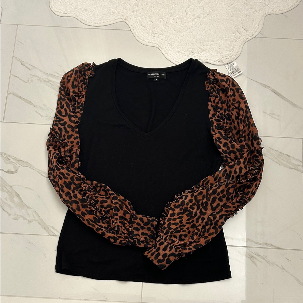 GENERATION LOVE black top with leopard print sleeves with ruffle design